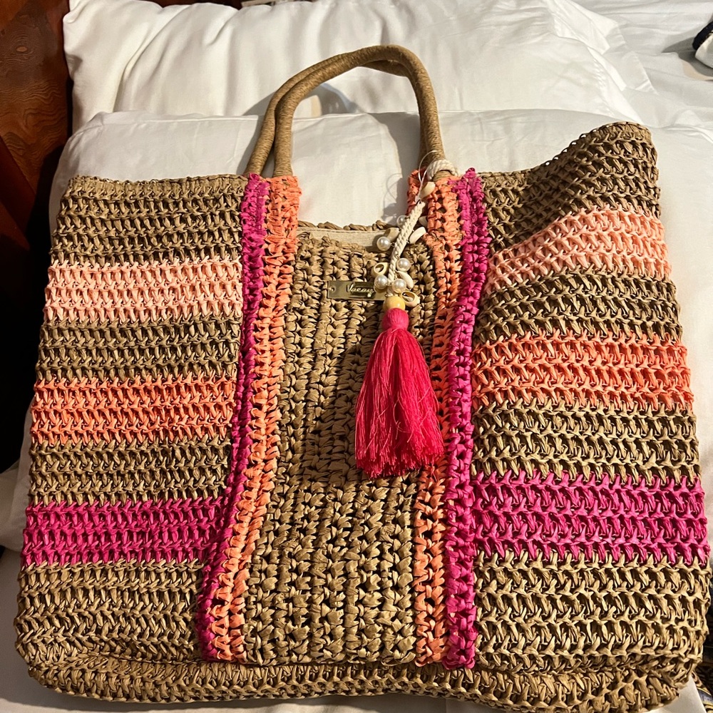 Cute straw tote bag.  Never used.   New without tags